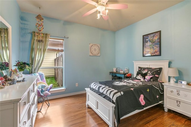 bedroom with ceiling fan and hardwood / wood-style floors