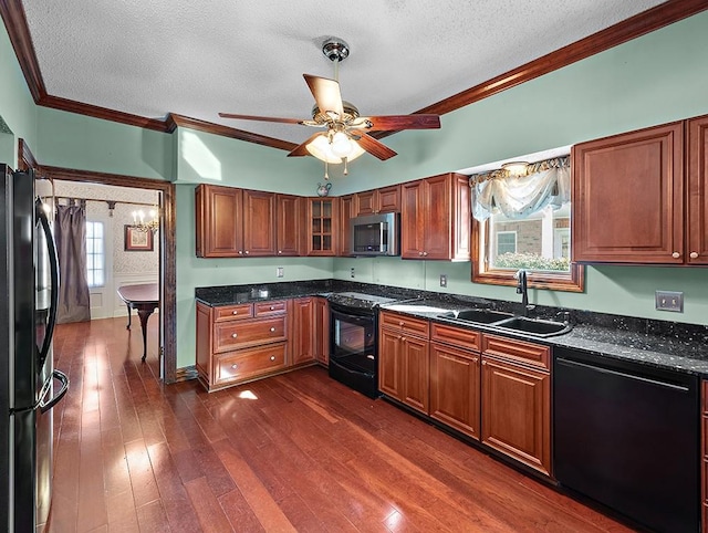 kitchen featuring sink, crown molding, black appliances, and a textured ceiling