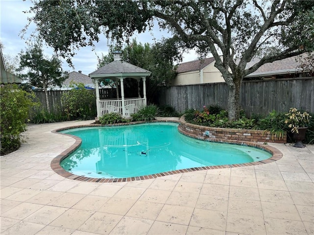 view of swimming pool with a gazebo and a patio area