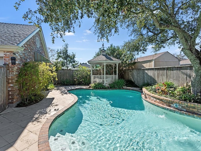 view of pool with a gazebo and pool water feature