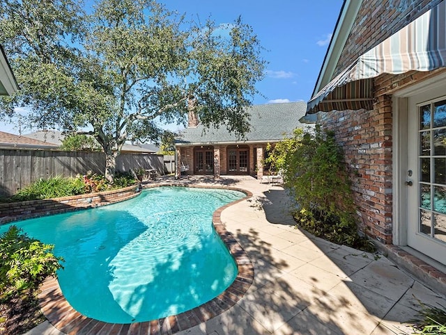 view of swimming pool featuring a patio