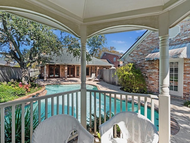 view of swimming pool featuring a patio area