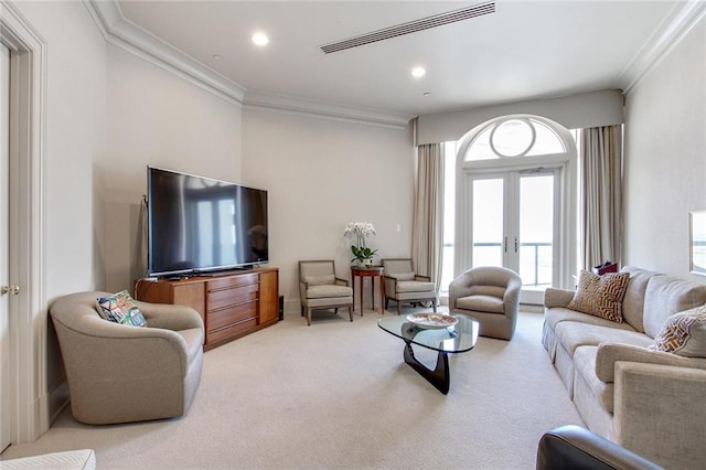 living room featuring crown molding, light carpet, and french doors