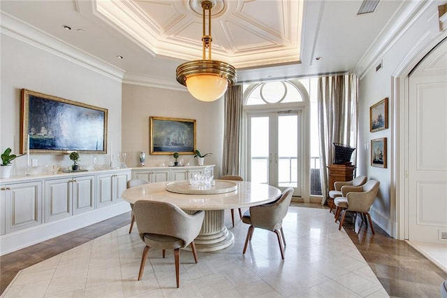 tiled dining space featuring crown molding and french doors