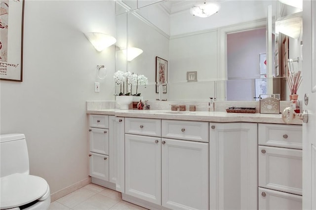 bathroom with tile patterned floors, vanity, and toilet