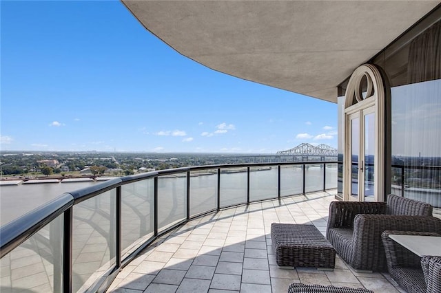 balcony featuring a water view