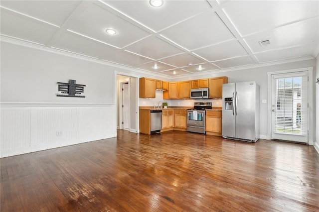 kitchen featuring dark hardwood / wood-style flooring, coffered ceiling, and stainless steel appliances