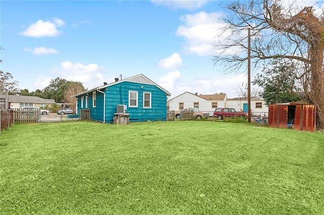 rear view of property featuring a yard