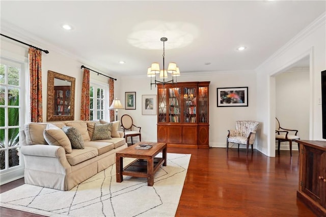 living room with crown molding, dark hardwood / wood-style flooring, and a notable chandelier