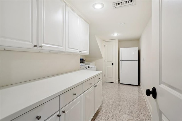 laundry room with washer and clothes dryer