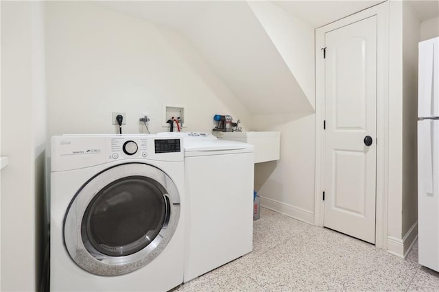 laundry room with independent washer and dryer