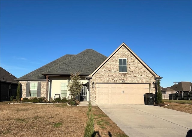 view of front facade with a garage and a front yard