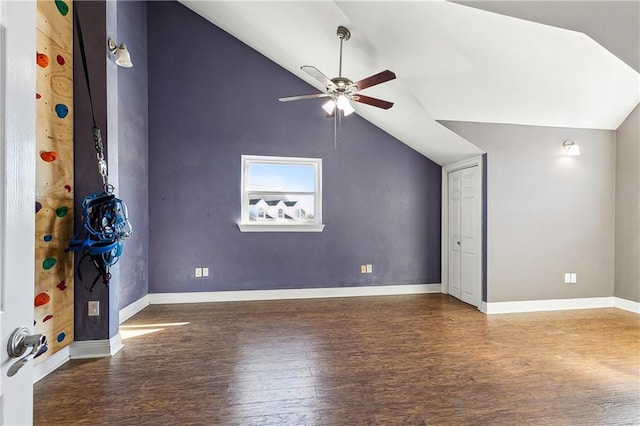 additional living space featuring lofted ceiling, dark hardwood / wood-style floors, and ceiling fan