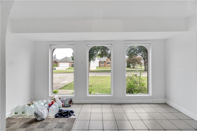 entryway with light tile patterned floors