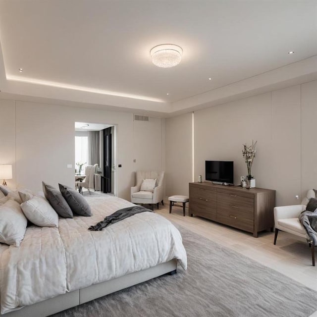 bedroom with a tray ceiling