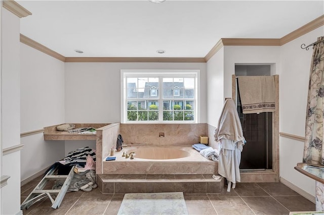 bathroom featuring tile patterned flooring, crown molding, and separate shower and tub