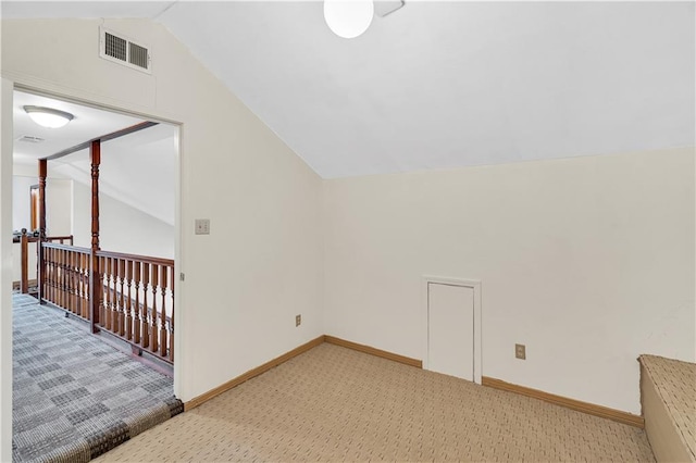 bonus room with carpet and lofted ceiling