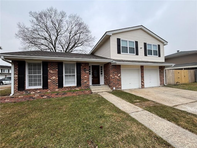 split level home with a garage and a front lawn