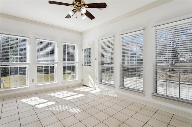 unfurnished sunroom featuring ceiling fan