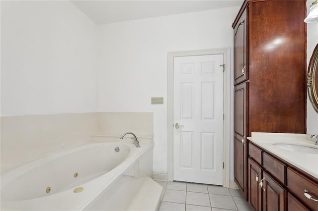 bathroom with vanity, tile patterned floors, and a tub to relax in