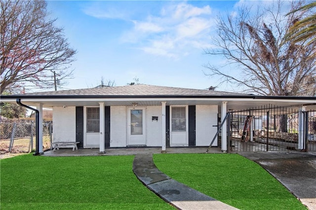 ranch-style home with covered porch and a front lawn