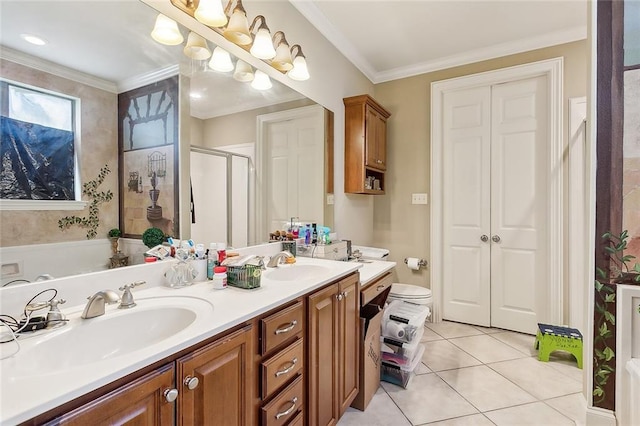 bathroom with tile patterned flooring, vanity, ornamental molding, a shower with shower door, and toilet