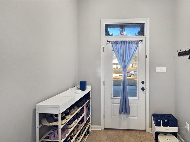 entryway featuring light tile patterned floors