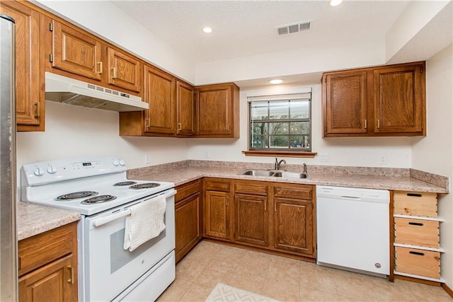 kitchen with sink and white appliances