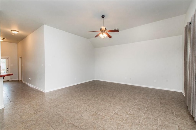 spare room featuring vaulted ceiling and ceiling fan