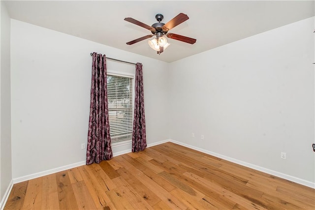 empty room featuring ceiling fan and wood-type flooring