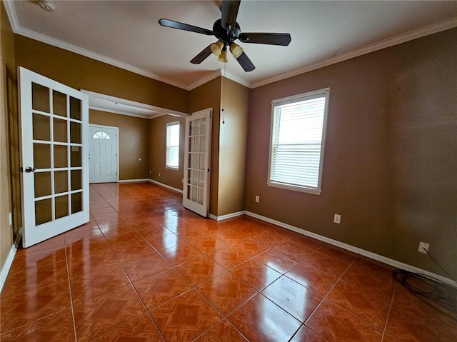 spare room featuring crown molding, french doors, and ceiling fan