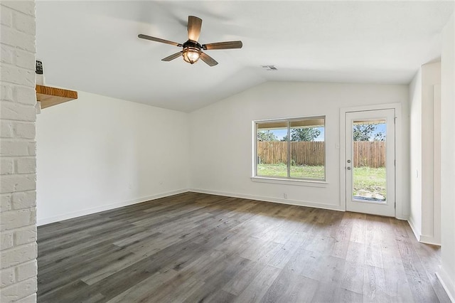 interior space featuring ceiling fan, lofted ceiling, and dark hardwood / wood-style floors