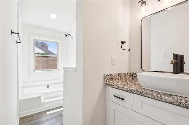 bathroom featuring hardwood / wood-style flooring and vanity