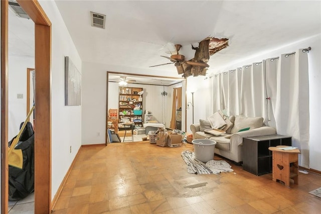 living area with ceiling fan