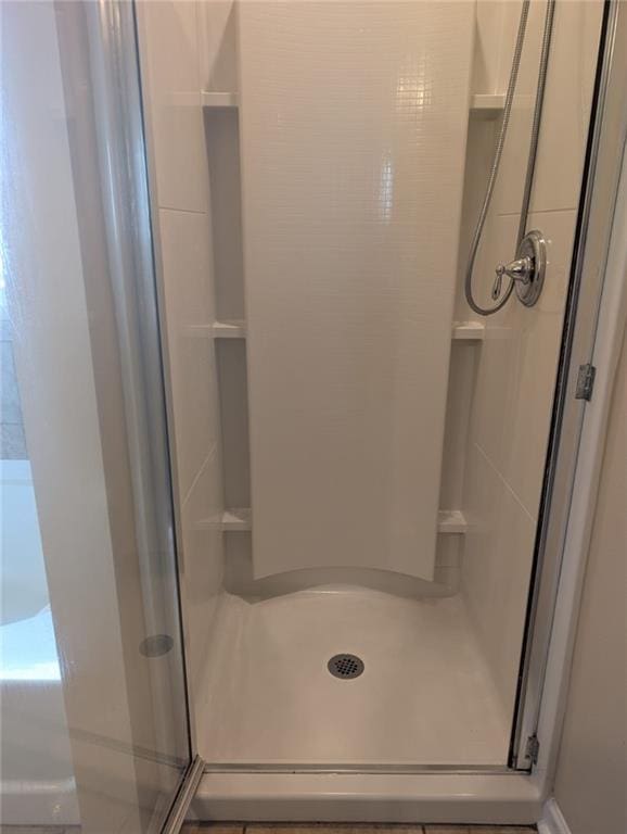 bathroom featuring an enclosed shower