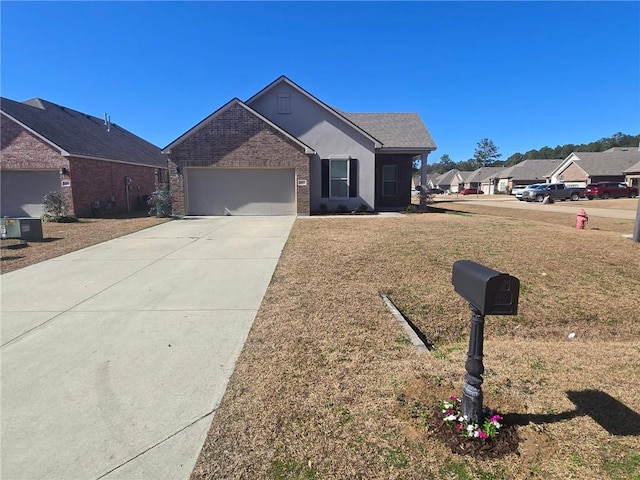 view of front of house featuring a garage and a front yard