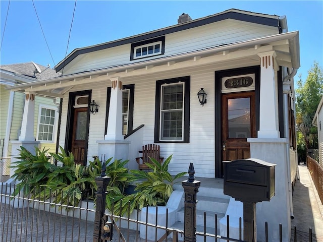 bungalow-style house featuring covered porch