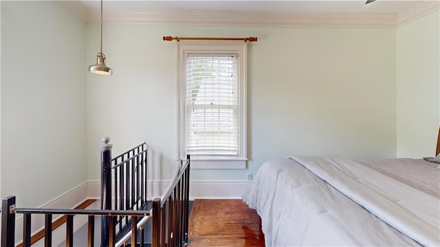 bedroom featuring ornamental molding and dark hardwood / wood-style flooring