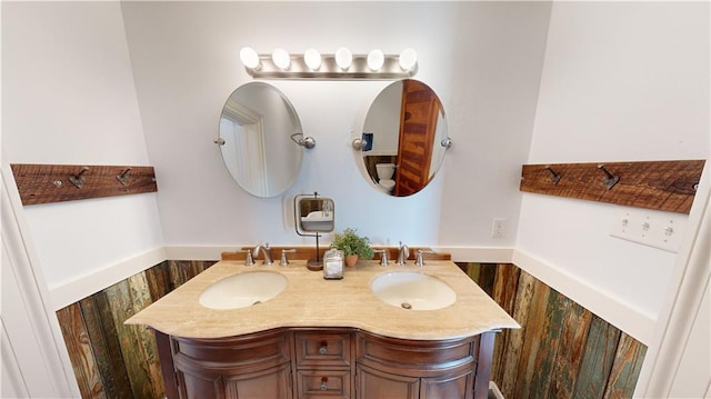 bathroom with vanity and hardwood / wood-style floors