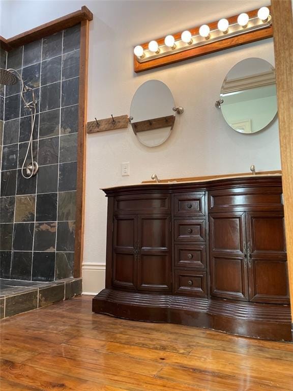 bathroom with vanity and wood-type flooring