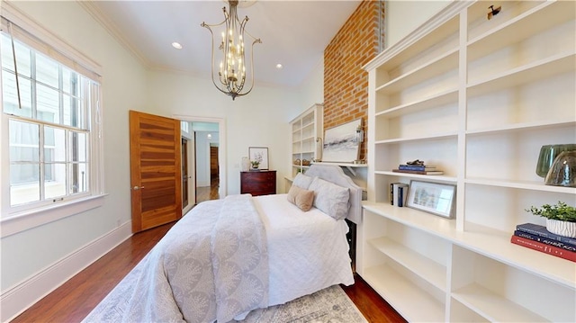 bedroom featuring crown molding, a notable chandelier, and dark hardwood / wood-style flooring