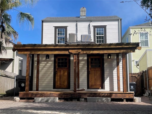 view of front facade with a porch and central air condition unit