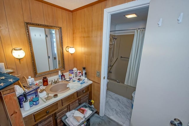 bathroom with shower / bathtub combination with curtain, vanity, and wood walls