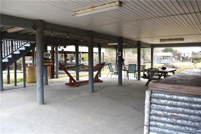 view of patio with stairway and outdoor dining area