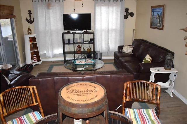 living room featuring dark wood-style floors and baseboards