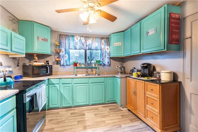 kitchen featuring ceiling fan, light hardwood / wood-style floors, sink, and stainless steel electric range