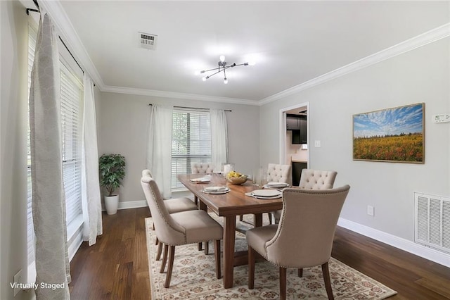 dining space with crown molding and dark hardwood / wood-style floors