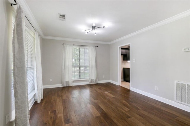 empty room with crown molding and dark wood-type flooring