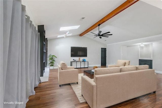 living room featuring lofted ceiling with skylight, wood-type flooring, and ceiling fan