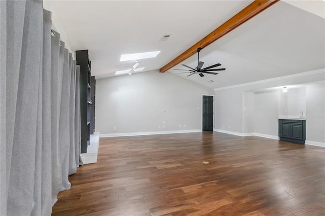 unfurnished living room featuring dark hardwood / wood-style flooring, sink, lofted ceiling with skylight, and ceiling fan